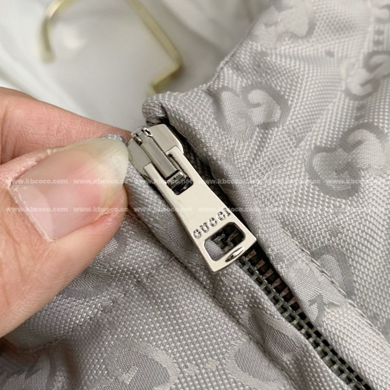 G*u*i Hooded patterned down jacket