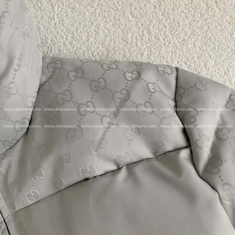 G*u*i Hooded patterned down jacket