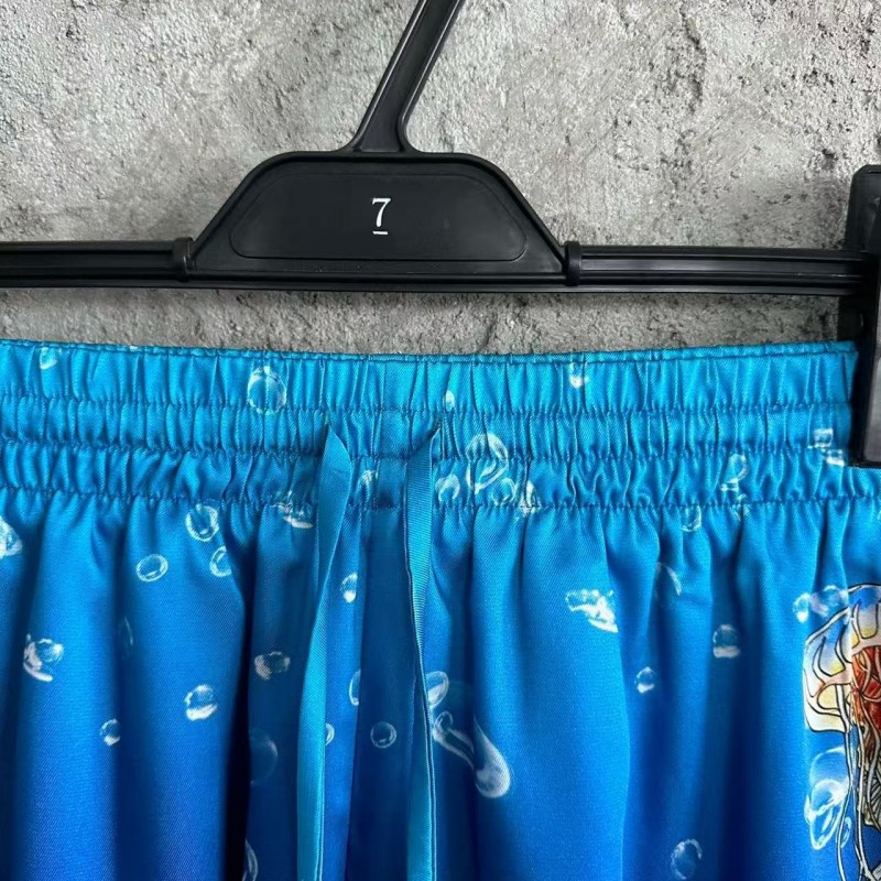 CASABLANCA Blue silk shorts with marine animal print