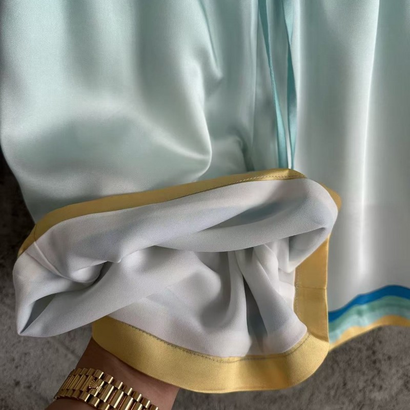 CASABLANCA Light blue silk shorts with ripple pattern