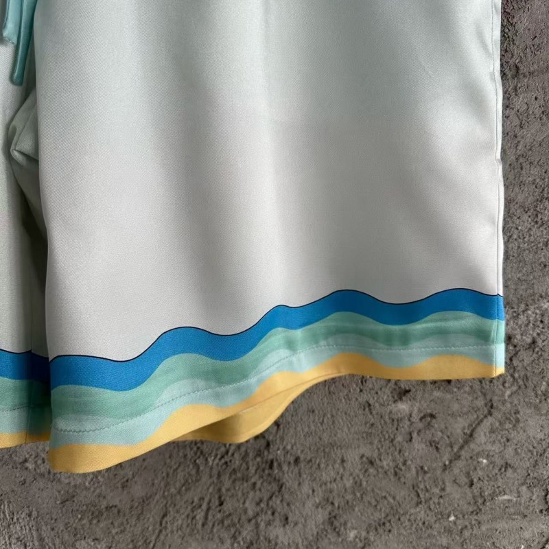 CASABLANCA Light blue silk shorts with ripple pattern