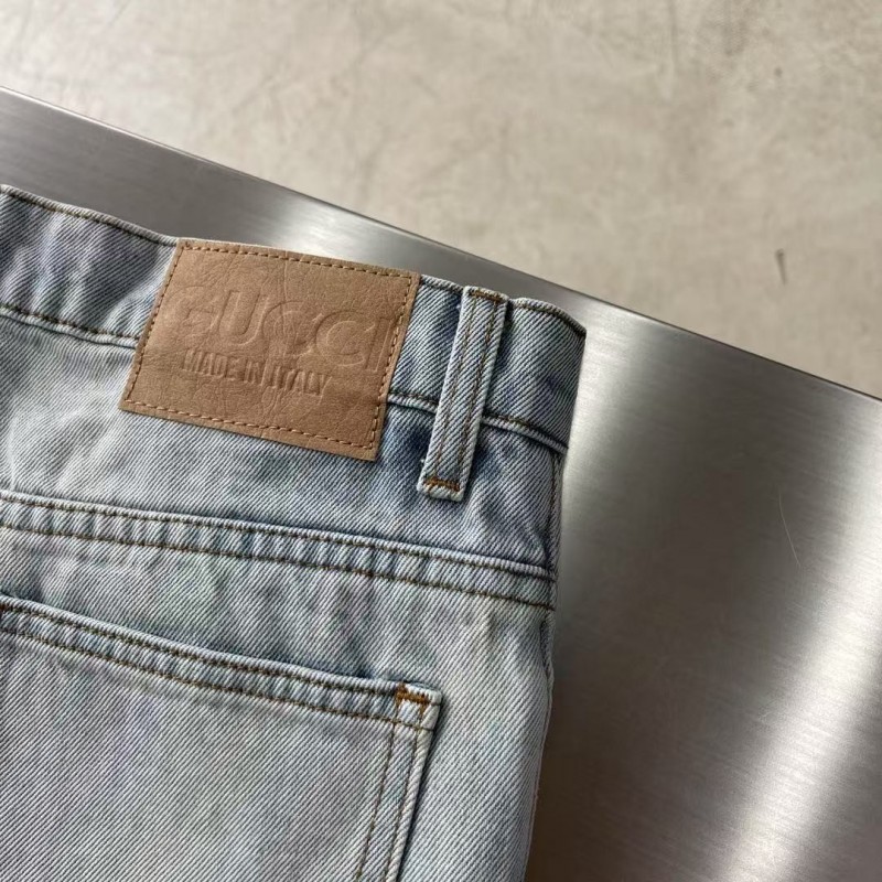 G*u*i cuffed washed jeans