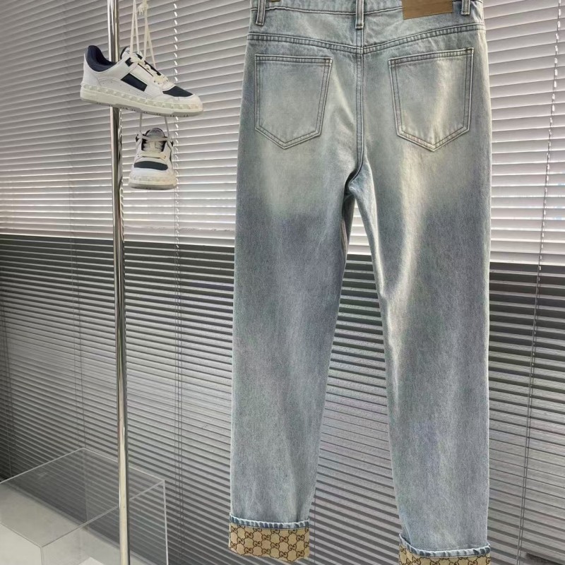 G*u*i cuffed washed jeans
