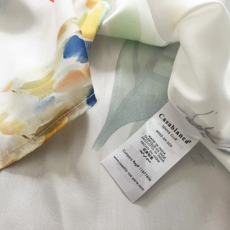 Casablanca Dotted orange silk blouse with loose, thin sleeves