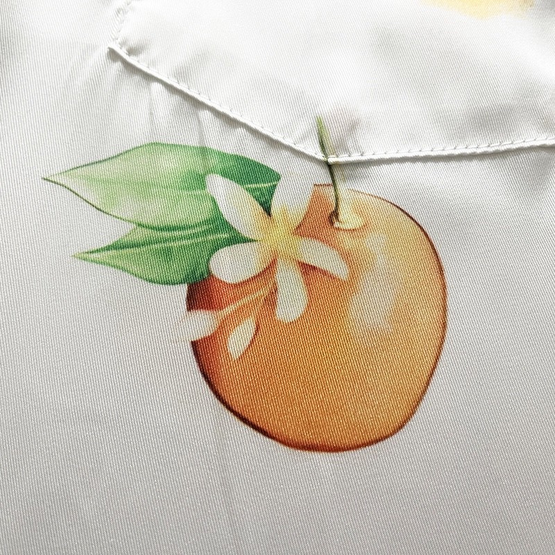 Casablanca Dotted orange silk blouse with loose, thin sleeves